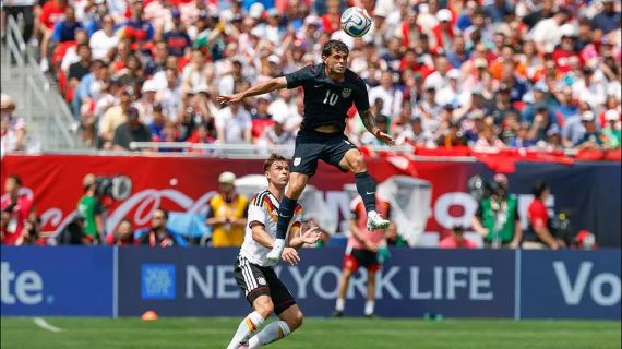 Christian Pulisic of the US men's team gets some air time during a friendly match against Germany